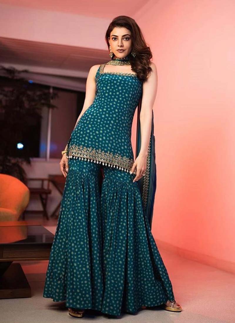 Dazzling Kajal In Peacock Blue Color Printed Sharara Suit